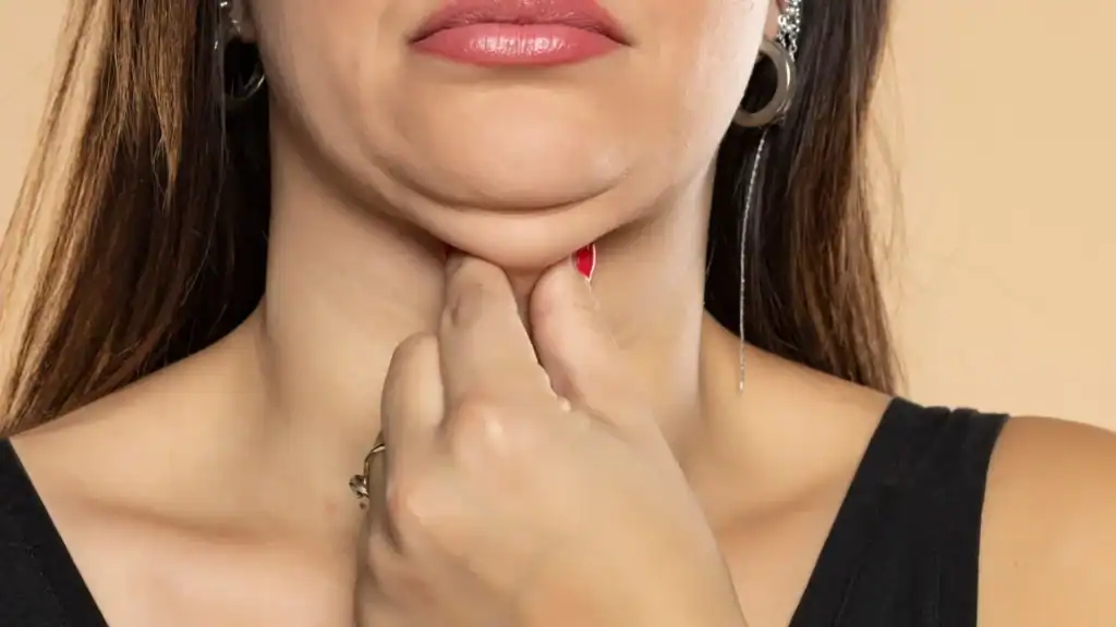 An image of a woman with double chin, sad, worried : Non Surgical Double Chin Removal Treatment in Oxshott, UK
